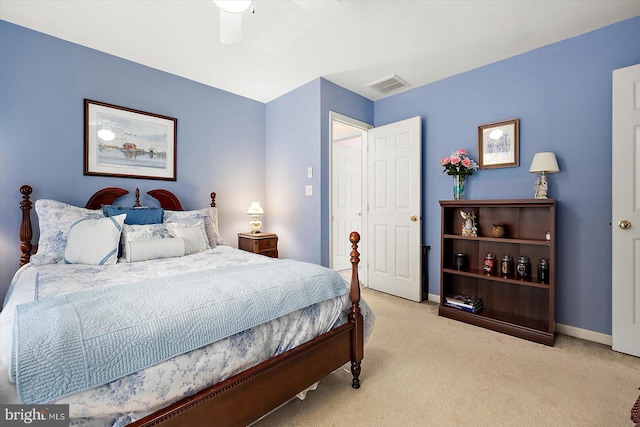 bedroom featuring ceiling fan and light carpet