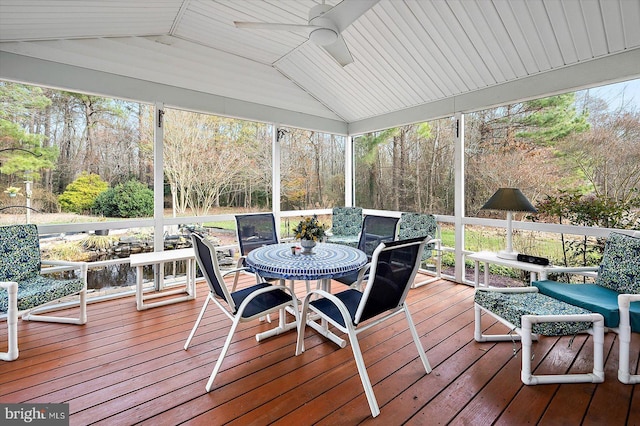 sunroom with vaulted ceiling, ceiling fan, and plenty of natural light