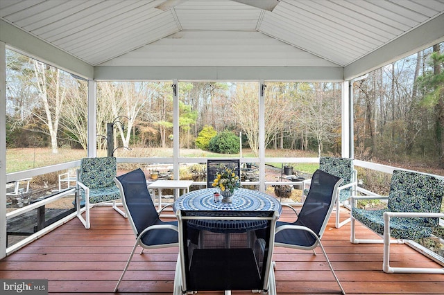 sunroom with a wealth of natural light, wood ceiling, and lofted ceiling