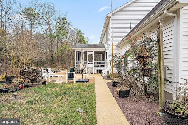 view of yard with a sunroom