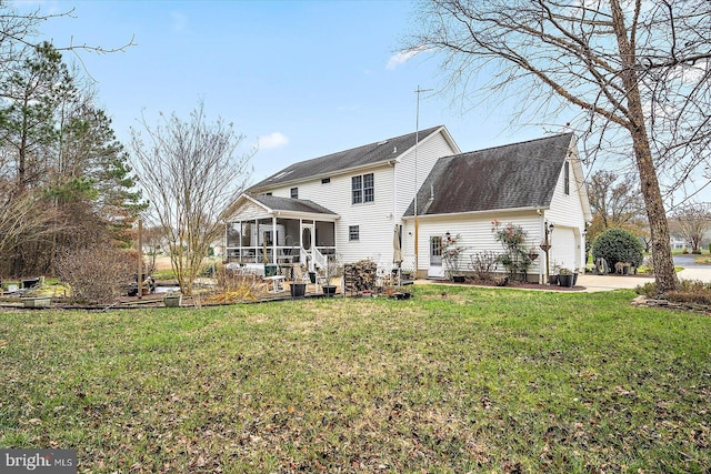 back of property featuring a sunroom and a lawn