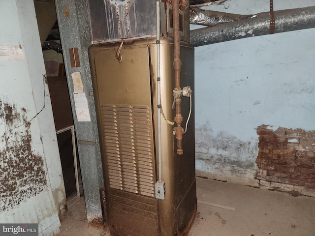 utility room featuring heating unit