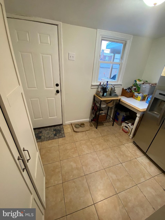 entryway featuring light tile patterned floors