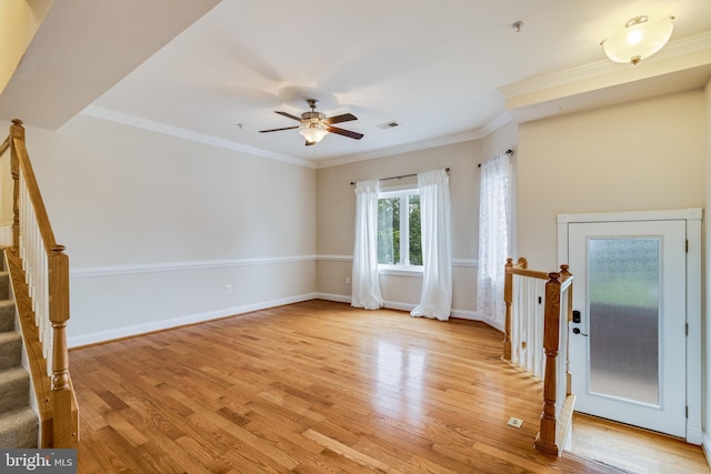 unfurnished room with light hardwood / wood-style floors, ceiling fan, and crown molding