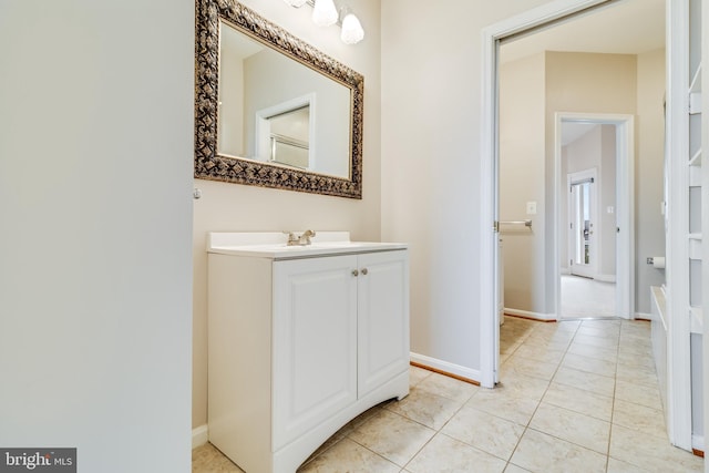 bathroom with tile patterned floors and vanity