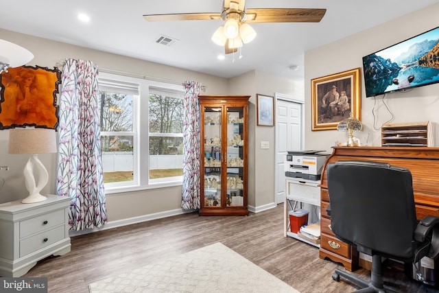 office area featuring wood-type flooring and ceiling fan