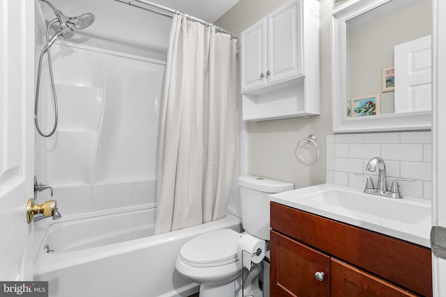 full bathroom featuring vanity, decorative backsplash, toilet, and shower / tub combo