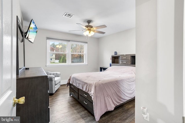 bedroom featuring dark hardwood / wood-style floors and ceiling fan