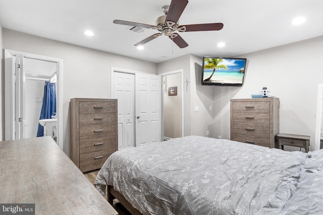 bedroom featuring ensuite bath and ceiling fan