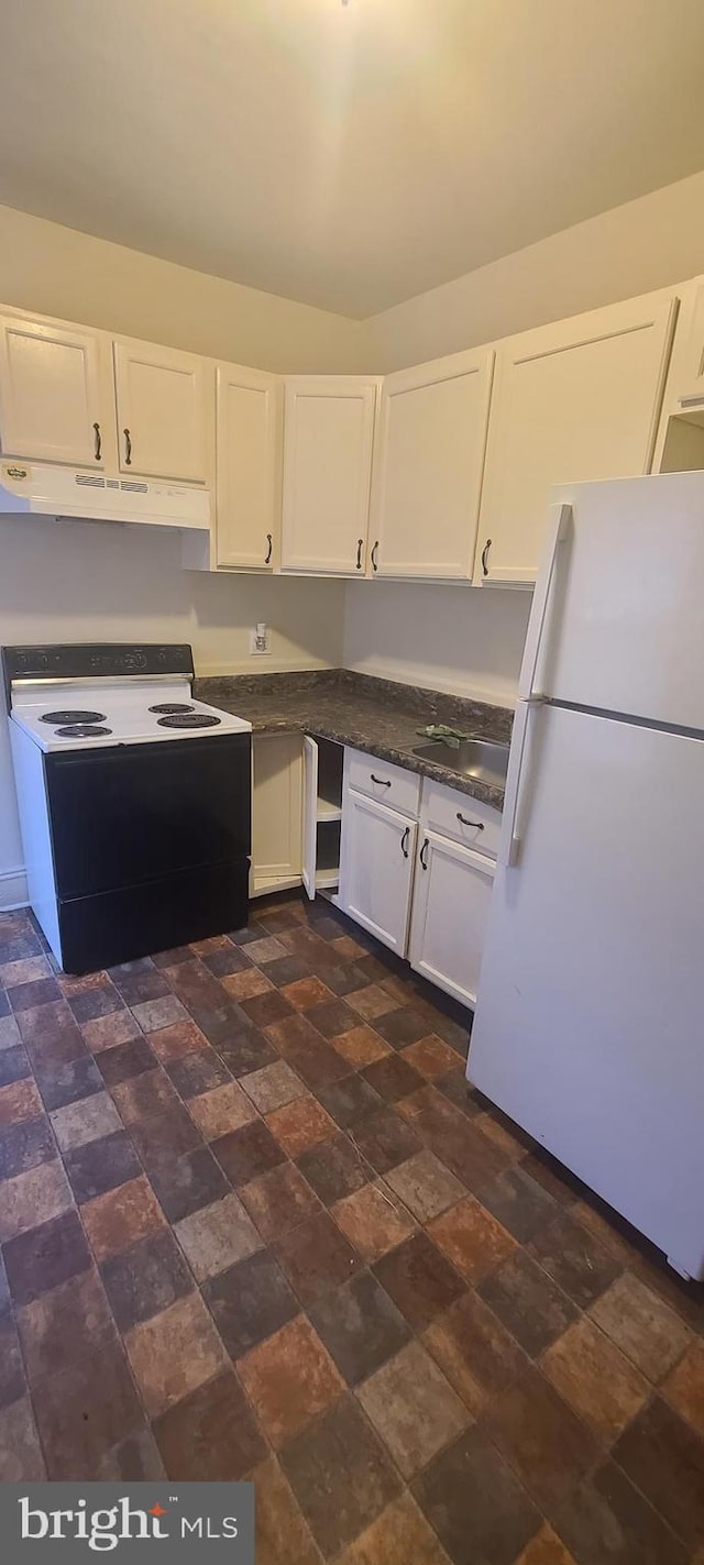 kitchen with white cabinets and white appliances