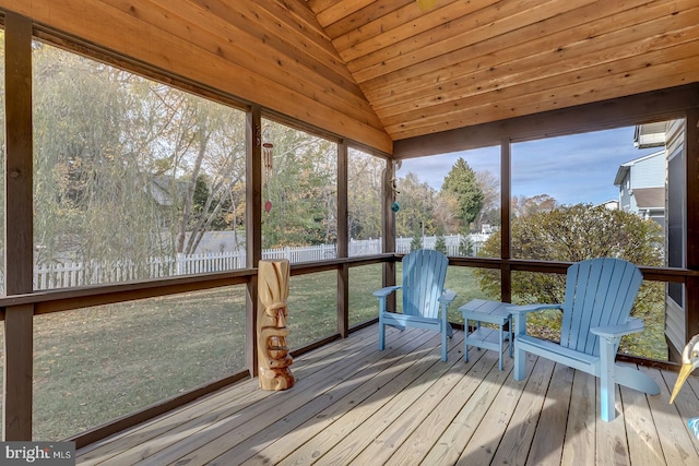 unfurnished sunroom featuring wooden ceiling and lofted ceiling