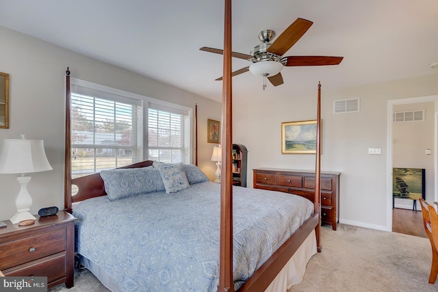 bedroom featuring ceiling fan and light colored carpet