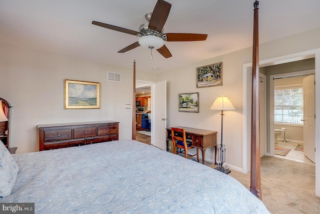 bedroom with light carpet, ceiling fan, and ensuite bathroom