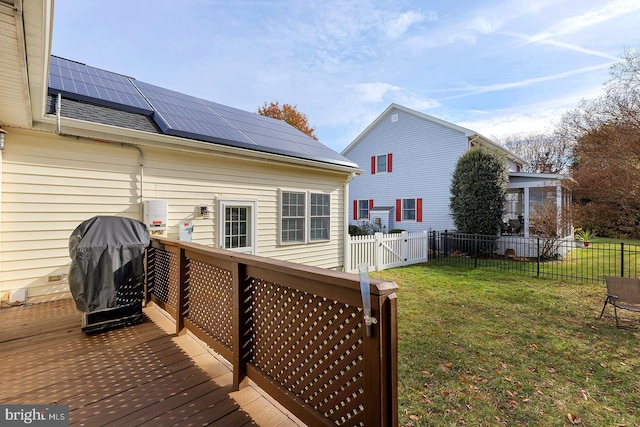 wooden deck with area for grilling and a lawn