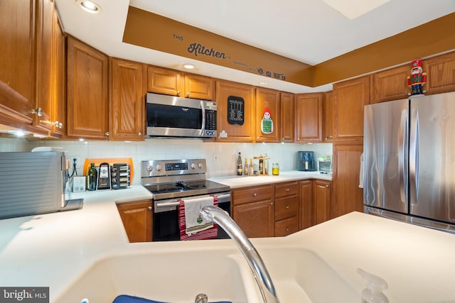 kitchen featuring appliances with stainless steel finishes and decorative backsplash