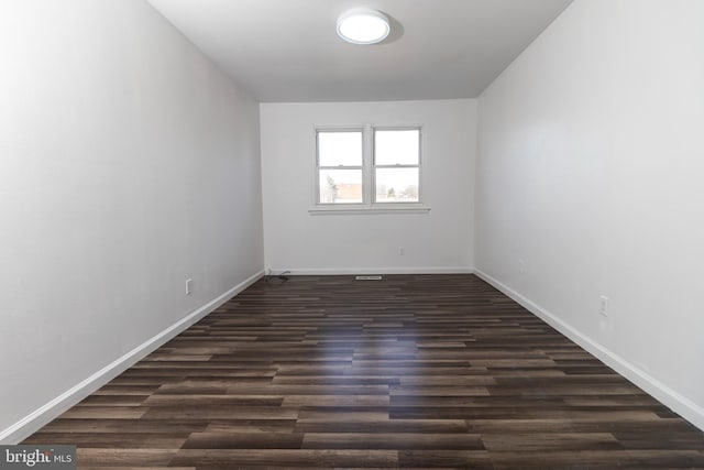 empty room featuring dark hardwood / wood-style floors