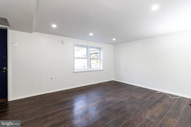 unfurnished room with dark hardwood / wood-style floors