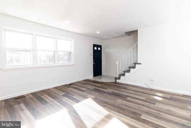 foyer featuring dark wood-type flooring