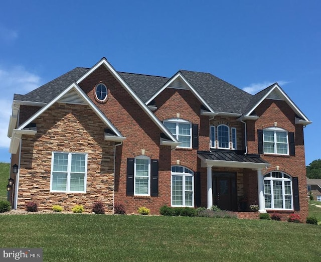 view of front of property with a front lawn