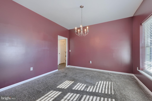 unfurnished room featuring carpet floors and a notable chandelier