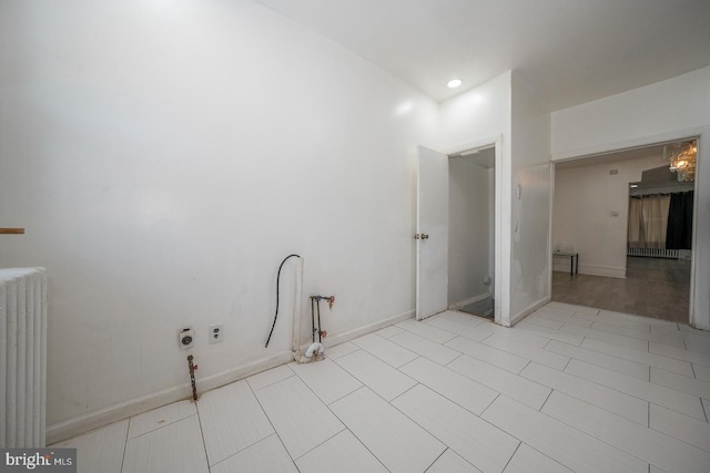 laundry room with radiator heating unit