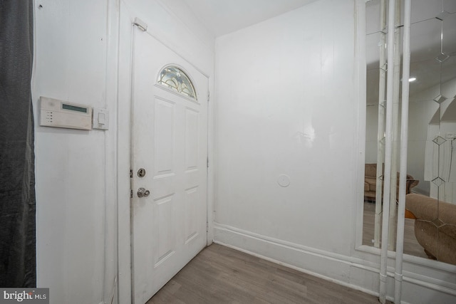 doorway with wood-type flooring