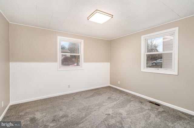 unfurnished room featuring carpet floors