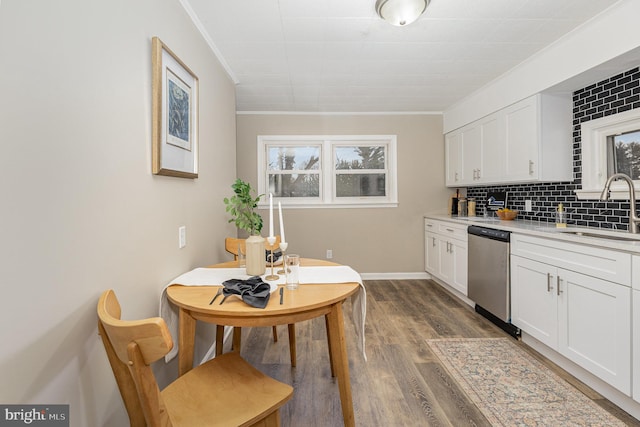 125 Evergreen St, Hummelstown, PA 17036 - kitchen with stainless steel dishwasher, ornamental molding, white cabinetry, light countertops, and decorative backsplash