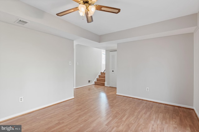 spare room featuring light hardwood / wood-style flooring and ceiling fan