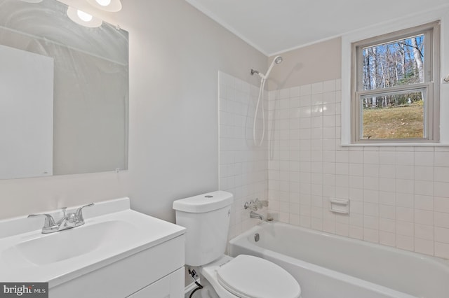 full bathroom featuring vanity, toilet, and tiled shower / bath combo