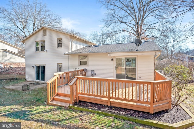 back of property with a wooden deck