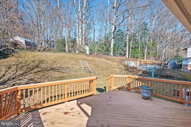 wooden deck with a lawn