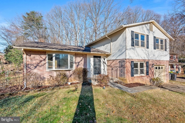 view of front of property with a garage and a front yard