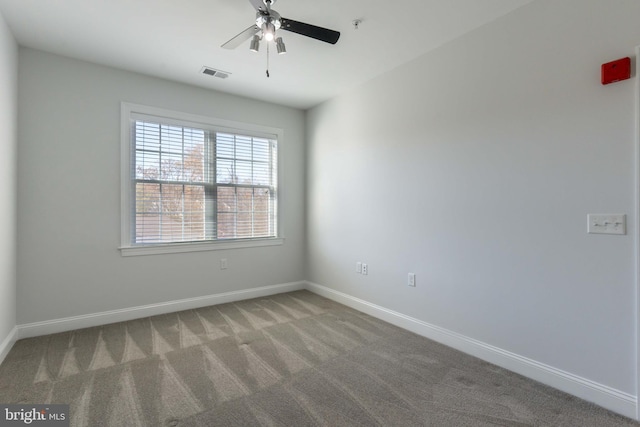 carpeted empty room with ceiling fan