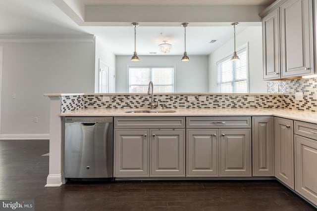 kitchen featuring pendant lighting, dishwasher, dark hardwood / wood-style flooring, and sink