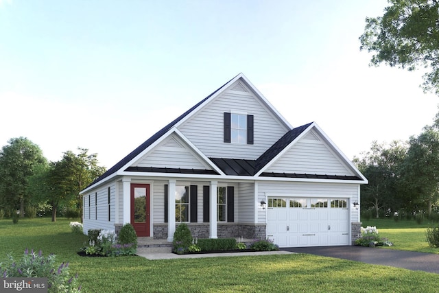 view of front of house with a front yard and a garage