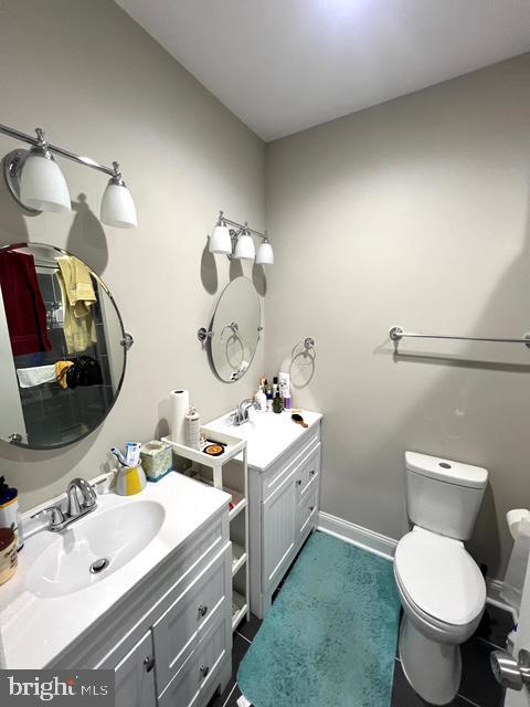 bathroom with vanity and toilet