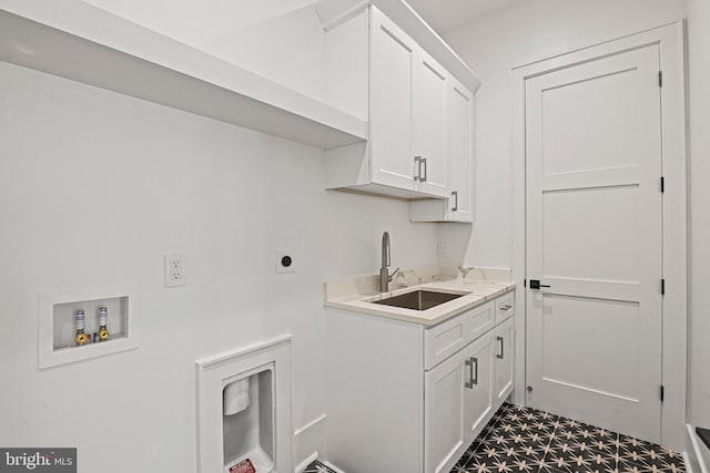 laundry room with hookup for an electric dryer, sink, cabinets, and washer hookup