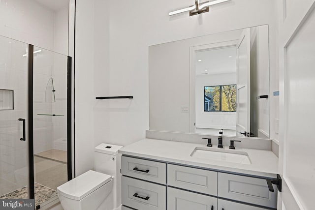 bathroom with vanity, an enclosed shower, and toilet