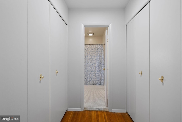 corridor featuring hardwood / wood-style flooring