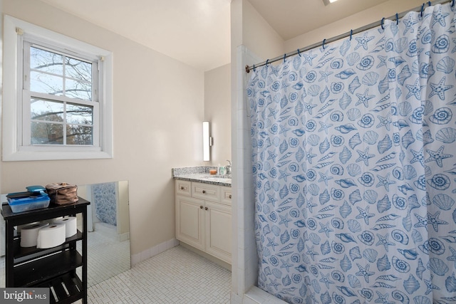 bathroom with tile patterned flooring, vanity, and a shower with shower curtain