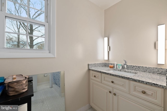 bathroom with tile patterned flooring and vanity