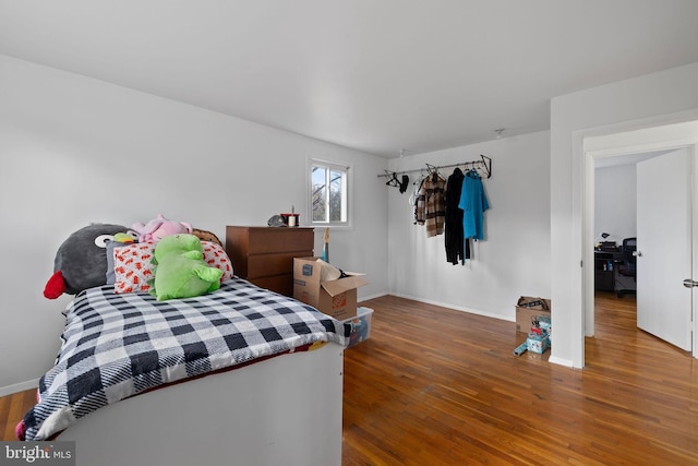 bedroom with wood-type flooring