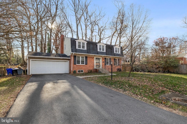 new england style home featuring a garage