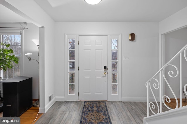 entryway with wood-type flooring