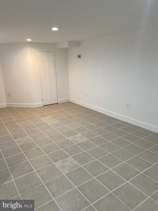 basement with tile patterned floors