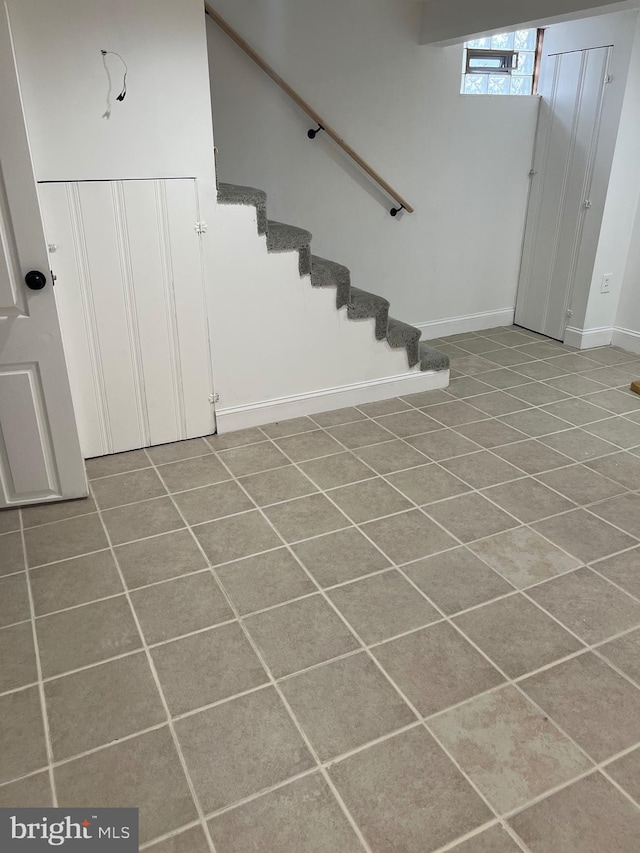 basement featuring tile patterned flooring