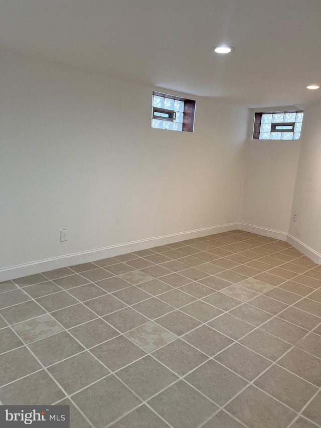 basement with light tile patterned flooring