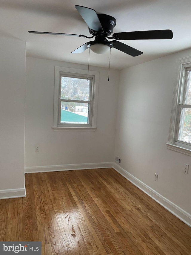 unfurnished room with light hardwood / wood-style floors