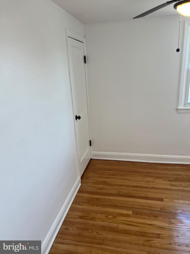 spare room featuring hardwood / wood-style flooring and ceiling fan